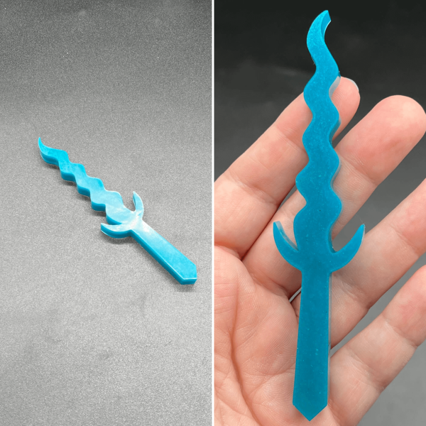 This Kris style dagger is made of turquoise resin and is a solid color.