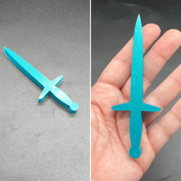 A longsword style dagger made with turquoise resin.