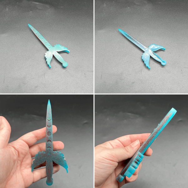 A small Poignard resin dagger made with red and turquoise resin.