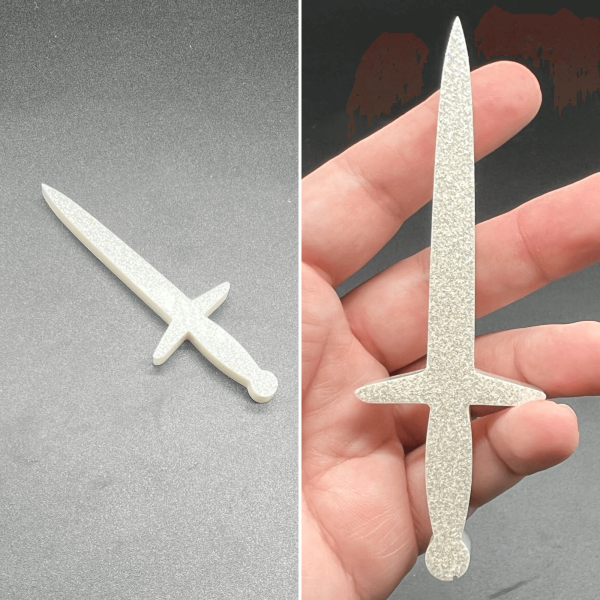 This longsword style dagger is made with white resin and white glitter. The glitter sank so the front is sparkly and the back is white.