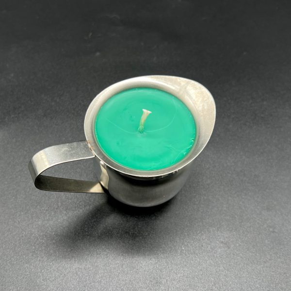 5 ounce green soy wax play candle in a stainless steel container with a handle and a pour spout