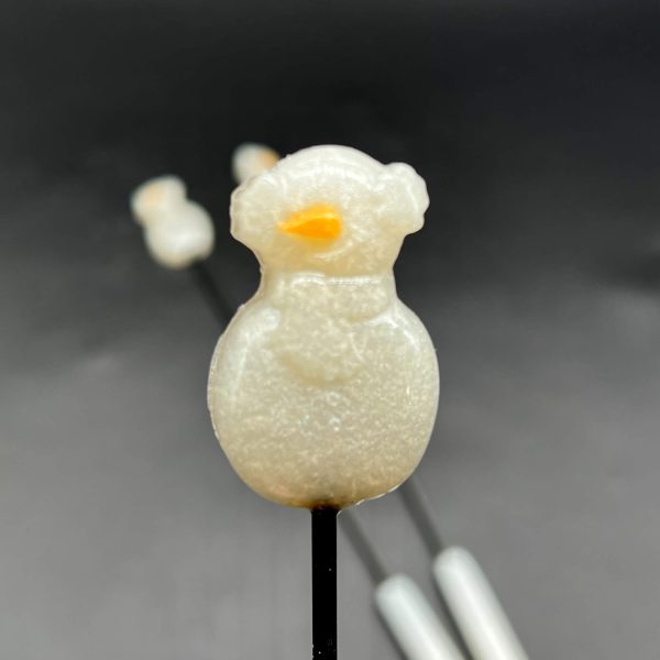 Resin snowman wearing ear muffs